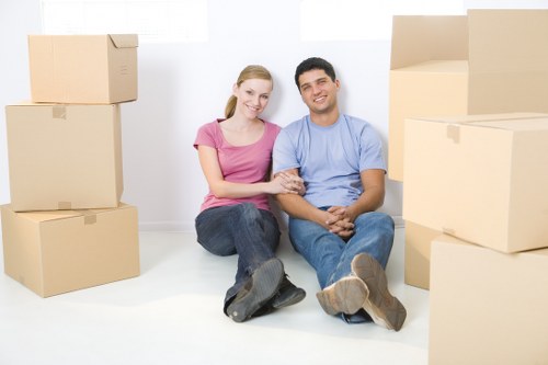 Moving team handling sofas and tables during Waterloo furniture removals
