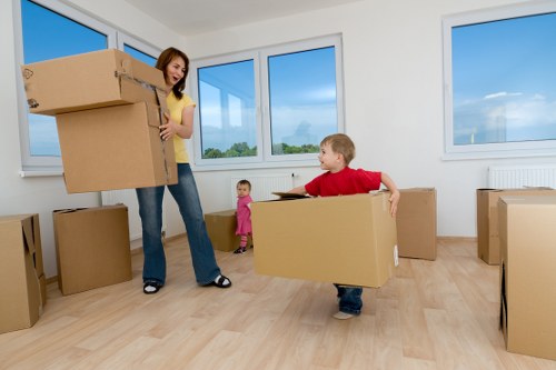 Trained movers handling furniture with care and caution