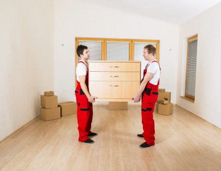 Trained movers handling fragile items during packing services in Waterloo